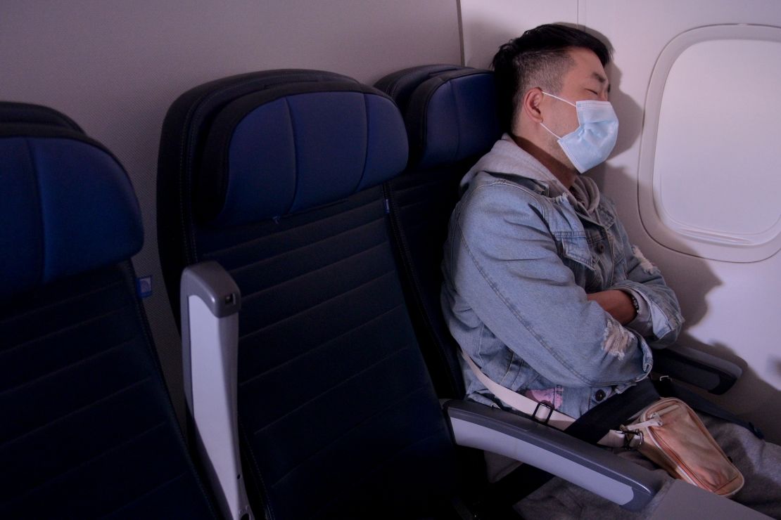 Wear a mask that covers your mouth and nose throughout your flight and stay seated as much as possible.