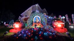 Houses are decorated with Christmas lights December 6, in Brooklyn's Dyker Heights section in New York City. The Christmas-decorated residences are an annual attraction, but have been scaled back due to Covid-19.