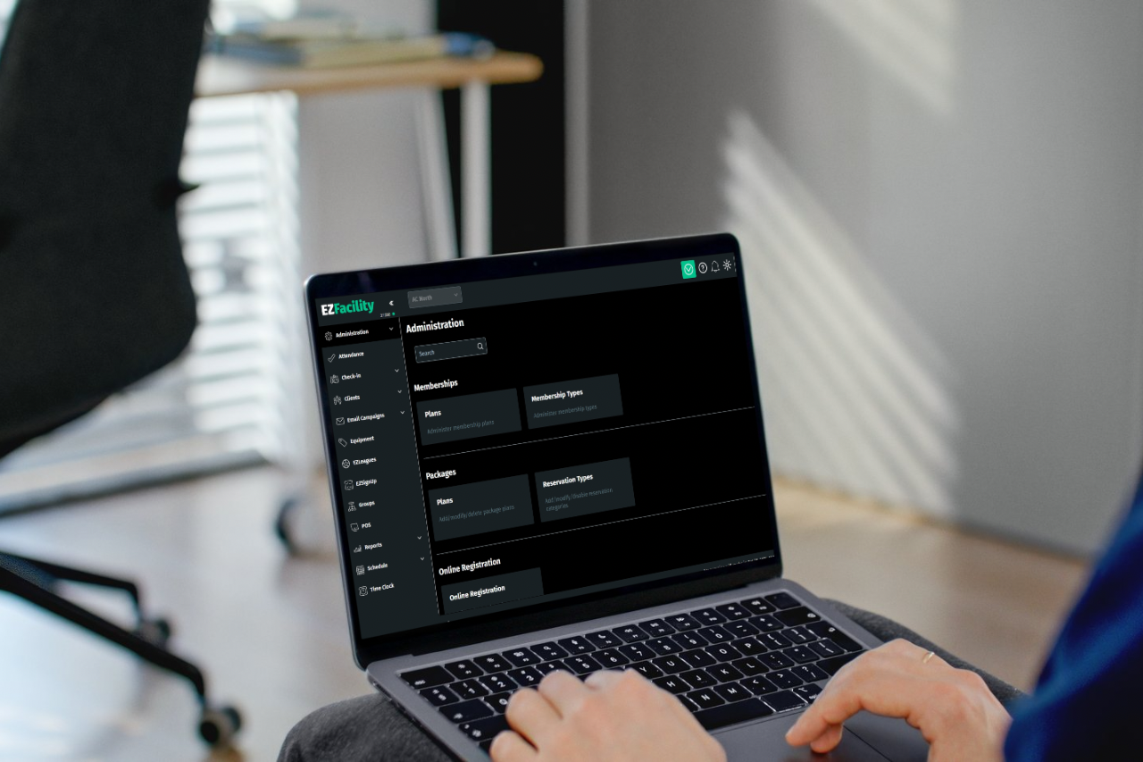 Person on laptop using EZFacility